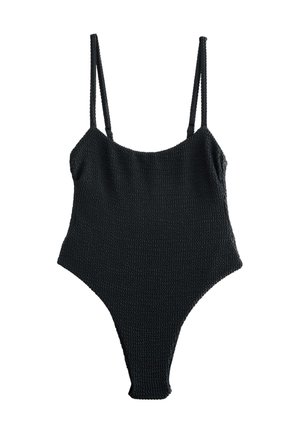 Bañador de una pieza negro de punto con tirantes finos, que presenta una superficie texturizada y un diseño de pierna de corte alto. Sin accesorios ni adornos adicionales.