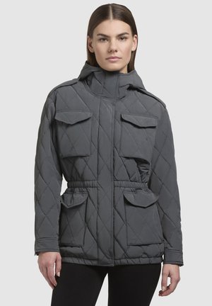 Padded grey jacket with a diamond quilted pattern, high collar, two chest pockets, and a drawstring waist. Smooth, matte texture.