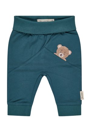 Dark teal baby pants with cuffed ankles and an embroidered teddy bear peeking from a diagonal seam pocket on the front right side.