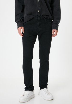 BRAD - Vaqueros slim fit - black