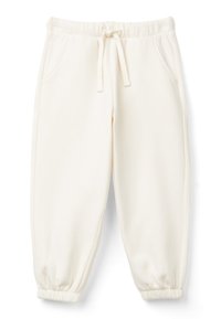 Beżowe spodnie dresowe wykonane z miękkiego materiału. Posiadają elastyczny pas ze sznurkiem, boczne kieszenie oraz zwężane mankiety.