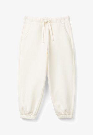 Cremfarbene Sweatpants aus weichem Stoff. Mit einem elastischen Bund mit Kordelzug, Seitentaschen und schmal zulaufenden Bündchen.