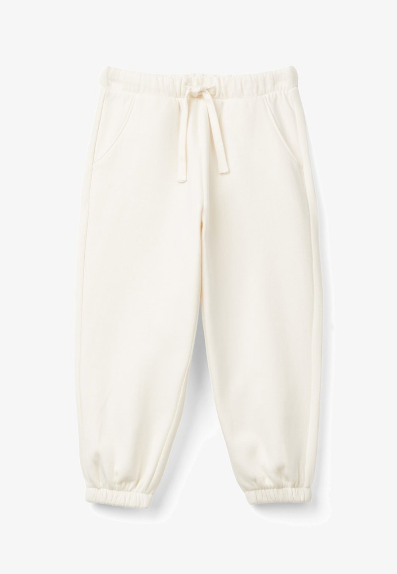 Beżowe spodnie dresowe wykonane z miękkiego materiału. Posiadają elastyczny pas ze sznurkiem, boczne kieszenie oraz zwężane mankiety.