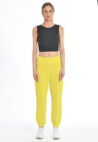 Deha Trainingsbroek - sunshine yellow