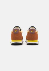 Men's sneakers featuring a combination of orange suede and tan leather, grey accents, yellow midsole, and black rubber outsole.