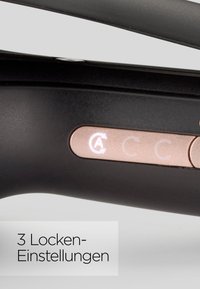 Curling iron handle in black with rose gold buttons. Features three adjustable curling settings indicated by symbols on the control panel.