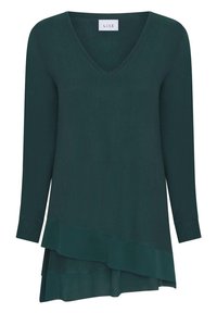 Mörkgrön långärmad topp med V-ringning, med en asymmetrisk lager-hem design och en slät textur.
