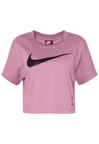Rosa kortärmad t-shirt i bomull med rund halsringning. Har en stor svart Nike-logga framtill och en mindre logga på sidan.
