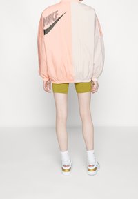 Nike Sportswear Větrovka - orange