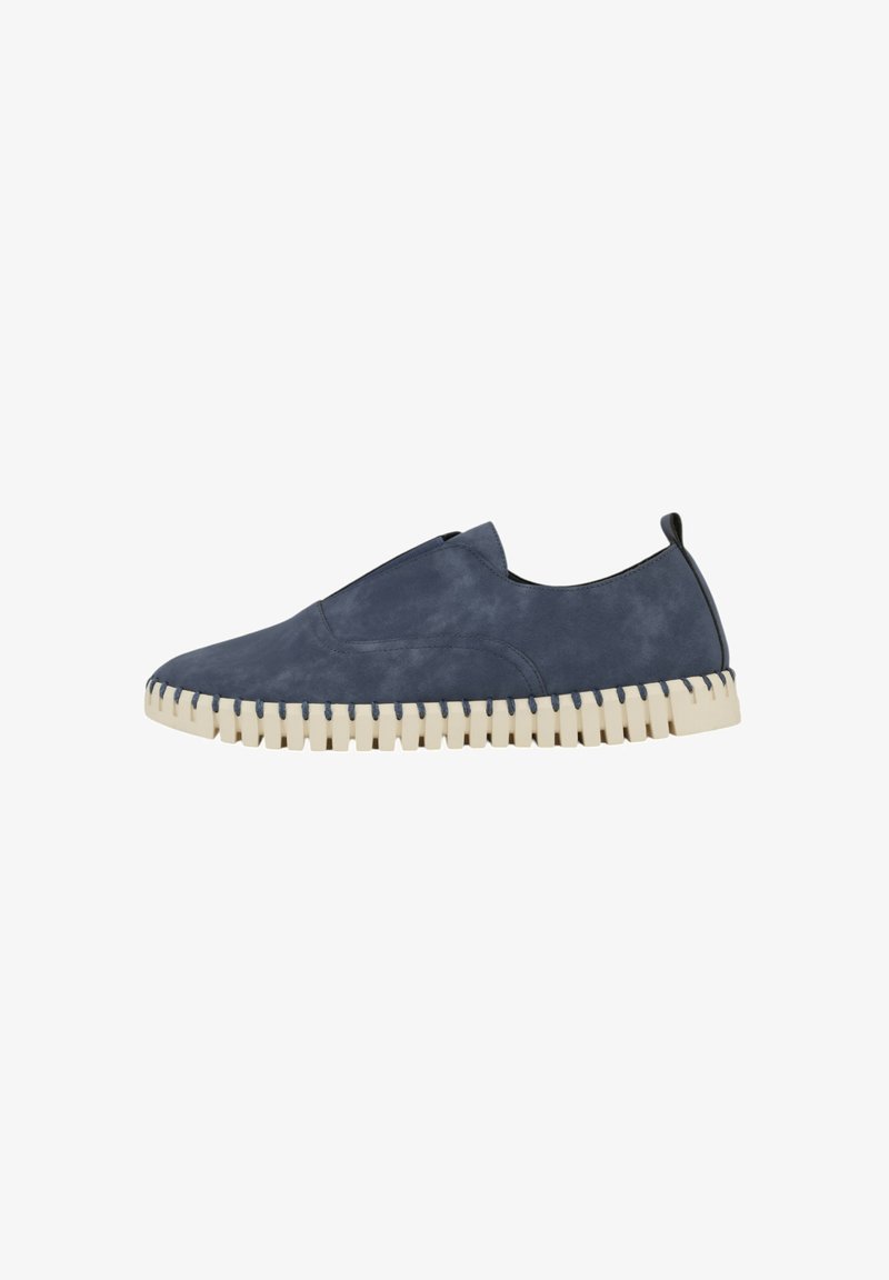 Navy blue slip-on shoes with a smooth suede texture and a contrasting cream rubber sole, featuring a unique zigzag edge and back pull tab.