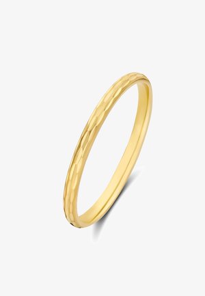 Bague en or avec un anneau lisse, présentant une texture martelée subtile. Le design est fin et élancé, mettant en avant une élégance simple.