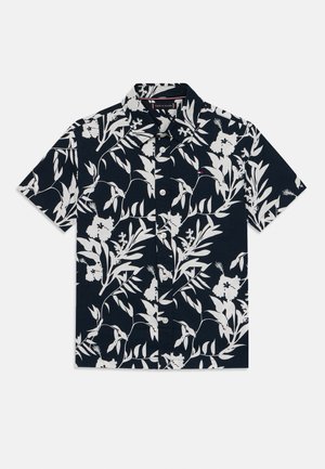 Camicia a maniche corte e bottoni di colore blu navy con motivo floreale e foglie bianche. Materiale in cotone, colletto classico e dettagli con patta dei bottoni.