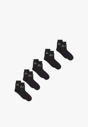 Black ankle socks made from soft fabric. Features light gray branding on the side. Five pairs displayed in a row.
