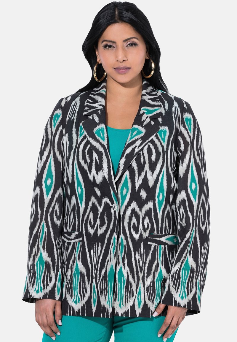 Svart blazer med ett djärvt mönster i vitt och teal i ikat, med en snibbkrage, två framfickor och stängning med en knapp.