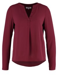 Chemise à manches longues bordeaux avec un léger col en V, patte de boutonnage et ourlet arrondi, fabriquée en tissu lisse et doux.