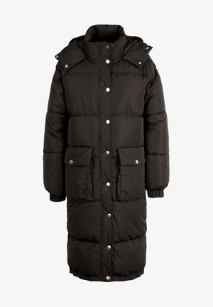 Must täiendus must puffer-kate, millel on kõrge kaelus, nööpkinnitused ja elastsed mansetid. Omab kahte esikäsi taskut ning tikandit.