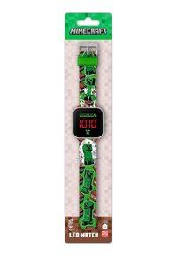 Montre LED Minecraft verte avec un écran numérique noir, dotée d'un bracelet à motif de graphics Creeper et TNT. Bouclerie argentée.