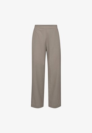 Béžové kalhoty širokého střihu s elastickým pasem, bez viditelných kapes nebo ozdob, zobrazené na bílém pozadí.