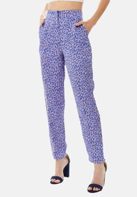 Lightweight, purple patterned pants with a geometric design, featuring a high waist, side pockets, and a tapered fit.