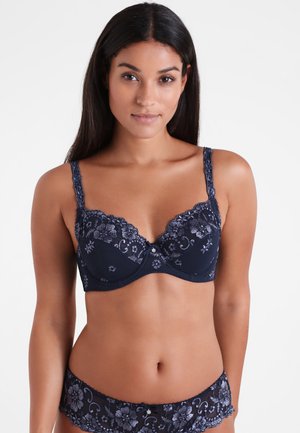 Navy blue lace bra with floral embroidery, underwire support, and scalloped edges; matching lace brief with similar floral pattern.