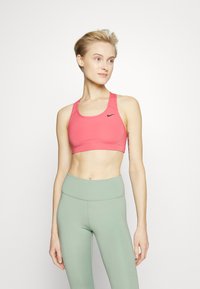 Nike Performance BRA - Sutiã desportivo de suporte médio - pink/schwarz