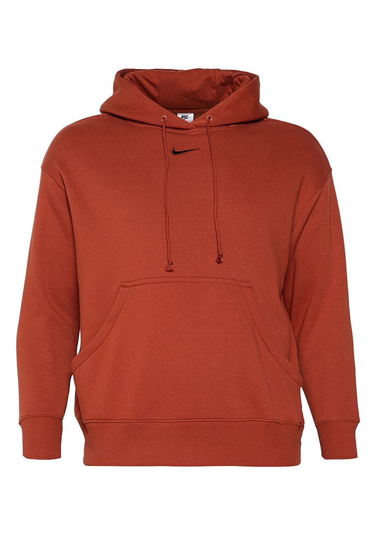 Rustfärgad Nike-hoodie med ficka fram, dragsko på huvan och svart logga på bröstet. Tillverkad av mjukt bomullsmaterial.