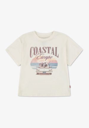 Īsrokas krēmkrāsas T-krekls no kokvilnas ar retro stila attēlu, kurā redzamas divas personas automašīnā ar tekstu "COASTAL Escape" saulrieta fonā.