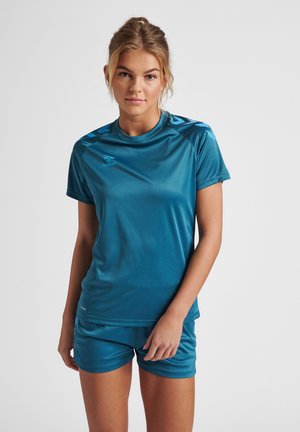 Teal athletic shirt and shorts set. The shirt has a crew neck, short sleeves, and subtle logo. Fabric appears smooth and moisture-wicking.