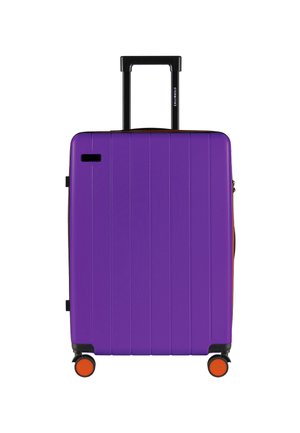 Purple hard-shell suitcase with vertical ridges, retractable black handle, and orange accent wheels. Zipper closure with side pocket detail.
