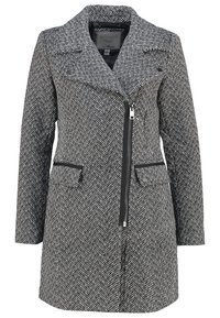 Abrigo de pata de gallo en blanco y negro con cuello de muesca, cierre de cremallera en la parte delantera, dos bolsillos laterales y tejido texturizado.