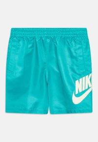 Turkizne športne hlače z elastičnim pasom, dvema stranskima žepoma in velikim belim logotipom Nike na sprednji desni strani. Gladka, sijoča tekstura.