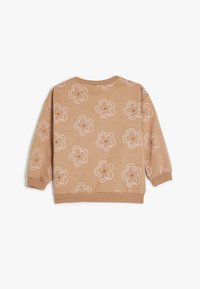 Brun sweatshirt med et blomsterdesign i lyserød og beige med ribstrikkede manchetter og halsudskæring. Blødt stof, afslappet design.