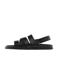 Black sandals with three wide, flat straps and a back ankle strap. Made of smooth synthetic material with a minimalistic design and a flat sole.