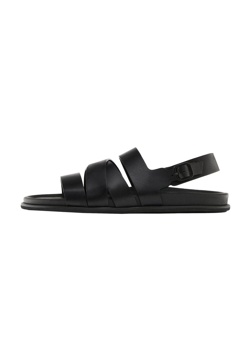 Black sandals with three wide, flat straps and a back ankle strap. Made of smooth synthetic material with a minimalistic design and a flat sole.