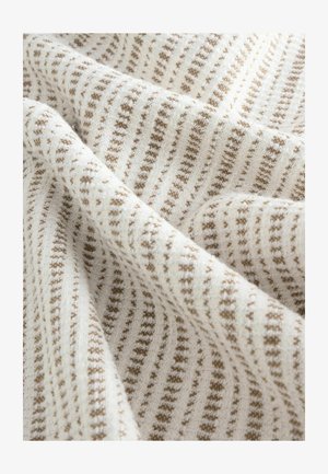 Tessuto lavorato a maglia con una base bianca e un motivo a quadri marroni. Presenta una texture morbida con righe uniformi e dettagli intricati.