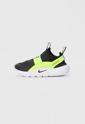 Juodas ir neoninės žalios spalvos slip-on tipo sportbačiai su tekstūruotu paviršiumi ir baltai taškuota padanga. Pasirinktinai yra ryškus logotipas ir užtrauktukas.