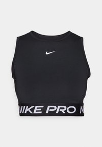 Černá sportovní podprsenka vyrobená z hladkého elastického materiálu. Má kulatý výstřih a široký elastický pás s bílým nápisem "NIKE PRO".