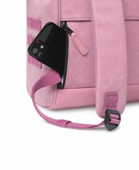 Pink faux leather backpack with a zippered pocket. A black smartphone is partially visible in the pocket. Adjustable pink strap with buckle detail.