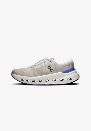 Light gray and blue running shoe with lace-up front, breathable mesh upper, cushioned sole with rectangular cutouts, and brand logo on side.