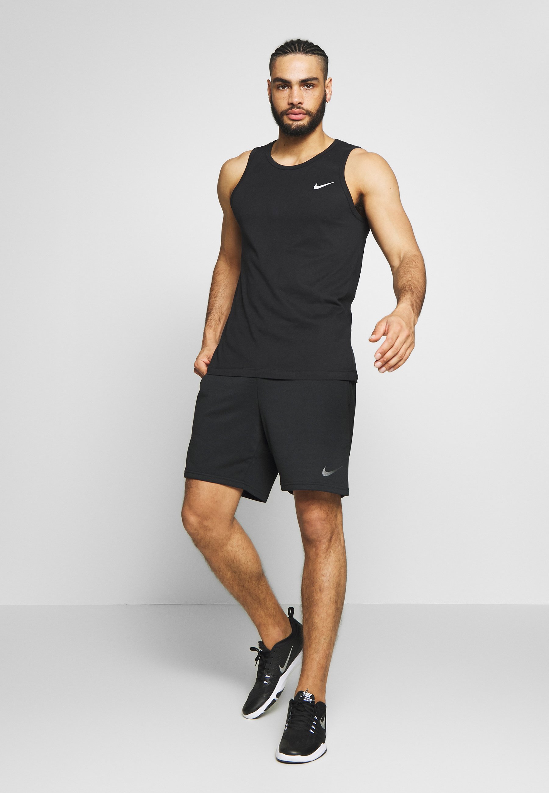 tank top and nike shorts