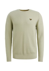 Suéter verde claro de diseño de punto texturizado, con cuello redondo y mangas largas. Un emblema bordado se encuentra en el lado izquierdo del pecho.