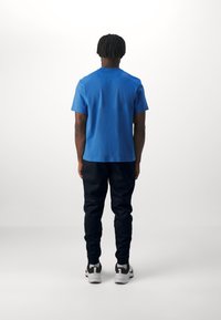 Nike Performance PRIMARY - Spordi T-särk - star blue