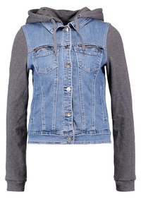 Denim jacket with gray long sleeves and hood, featuring button closure, chest pockets, and a fitted waist, combining textures and styles.