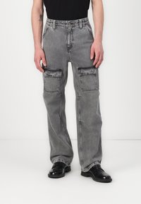 Cargo pants in faded gray denim, featuring a relaxed fit, multiple front pockets, and a straight leg design. Belt looped waist, smooth texture.