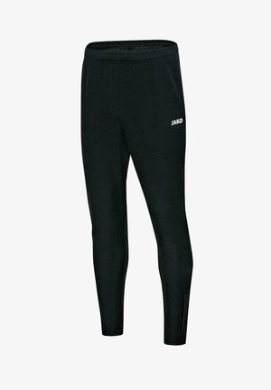 Schwarze Sporthose aus glattem Stoff, mit tailliertem Schnitt, seitlichen Reißverschlüssen an den Knöcheln und einem weißen "JAKO"-Logo auf dem Oberschenkel.