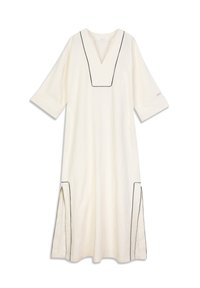 Robe en lin blanc cassé avec bordure noire, dotée d'un col en V, de manches trois-quarts et d'une fente latérale pour faciliter les mouvements.