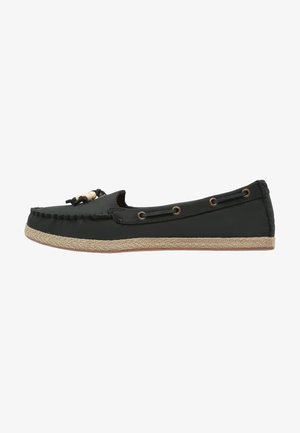 Chaussure noire à enfiler avec un bout rond, des perles décoratives, une tige en cuir et une semelle en corde de jute. Comprend des œillets dorés sur le côté.
