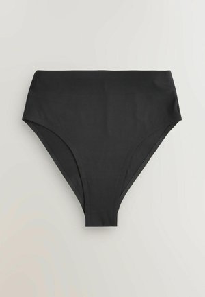 Bikini bottom nera a vita alta realizzata in tessuto morbido, con fessure laterali. Il design è minimalista, senza cuciture o pattern visibili.