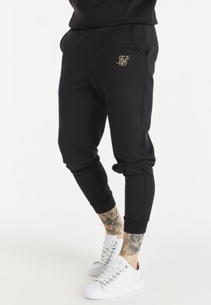 DIVISION PANTS - Pantaloni sportivi - black