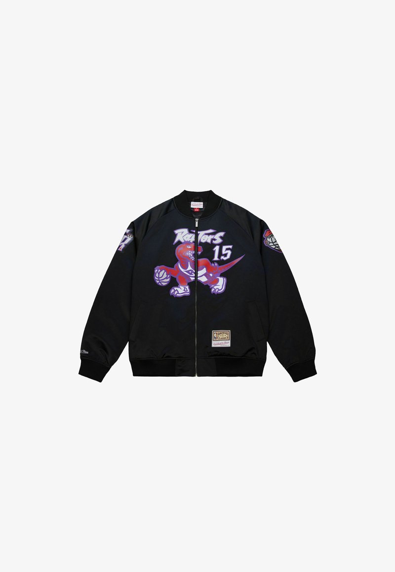 Giacca nera con zip, decorata con il logo del dinosauro dei Toronto Raptors che tiene un pallone da basket e il numero 15, con una patch dei NBA Hardwood Classics.